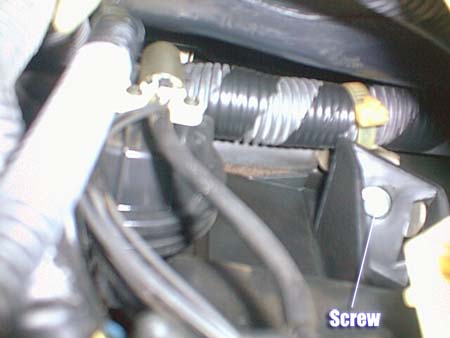 Screw above the glove box
